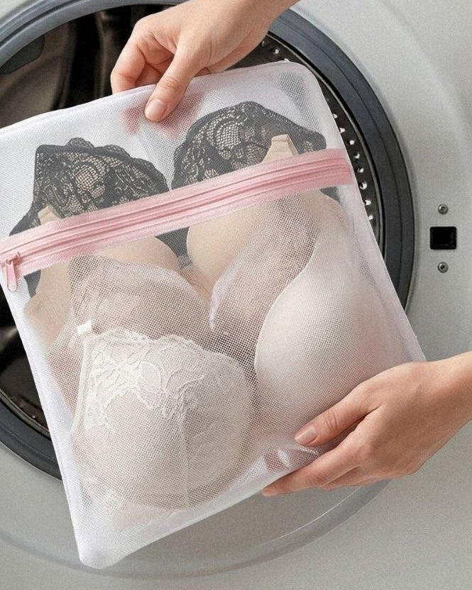Person placing a mesh bag with bras into a washing machine, with text about the $4 bag for good.