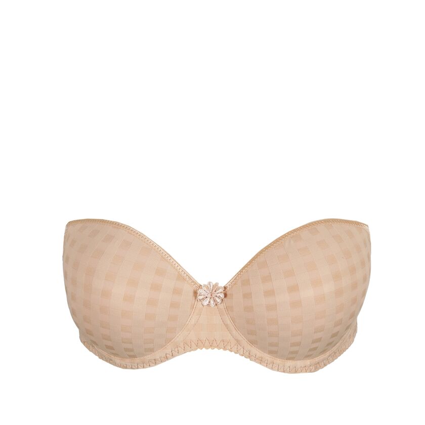 Beige bra with a decorative clasp on a white background