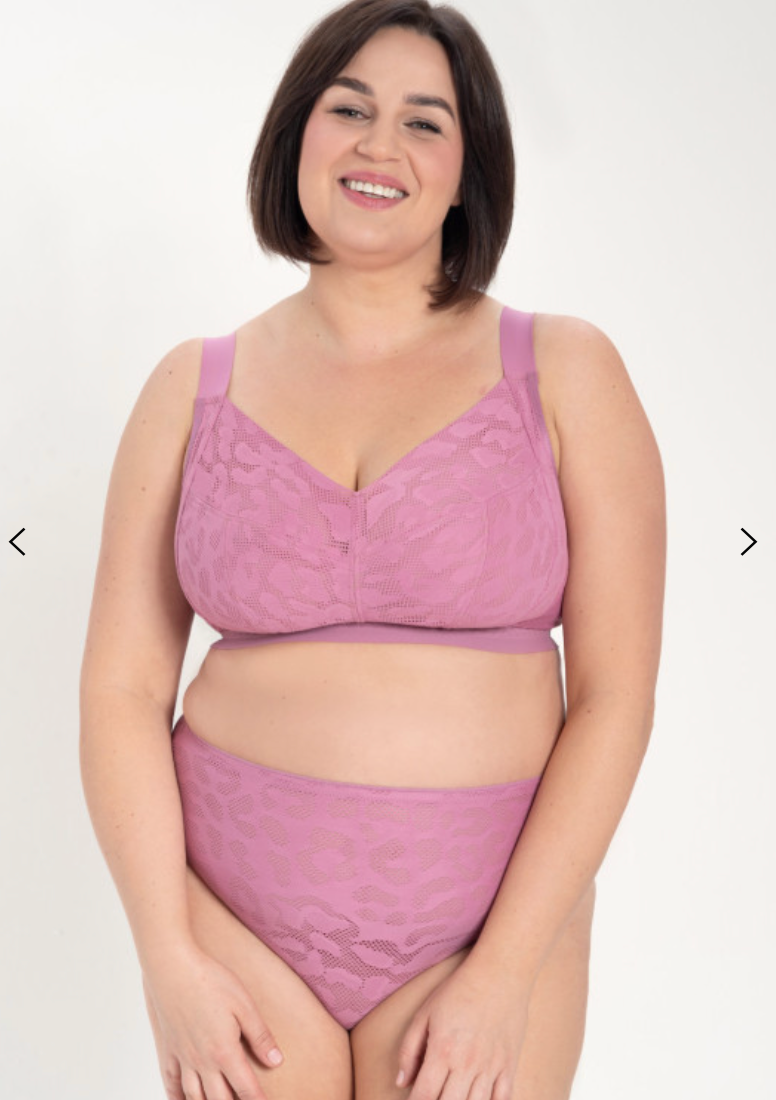 Woman wearing a purple lingerie set on a white background