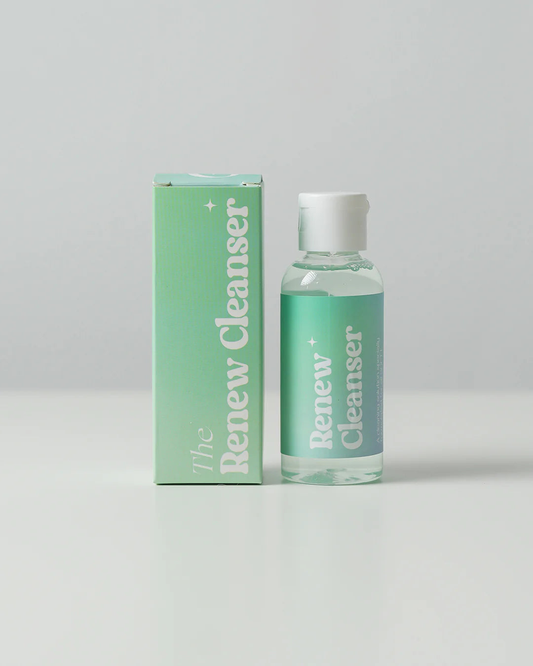 Softt Renew Cleanser bottle showcasing gentle formula for cleaning Softt adhesive products, perfect for maintaining stickiness and comfort.