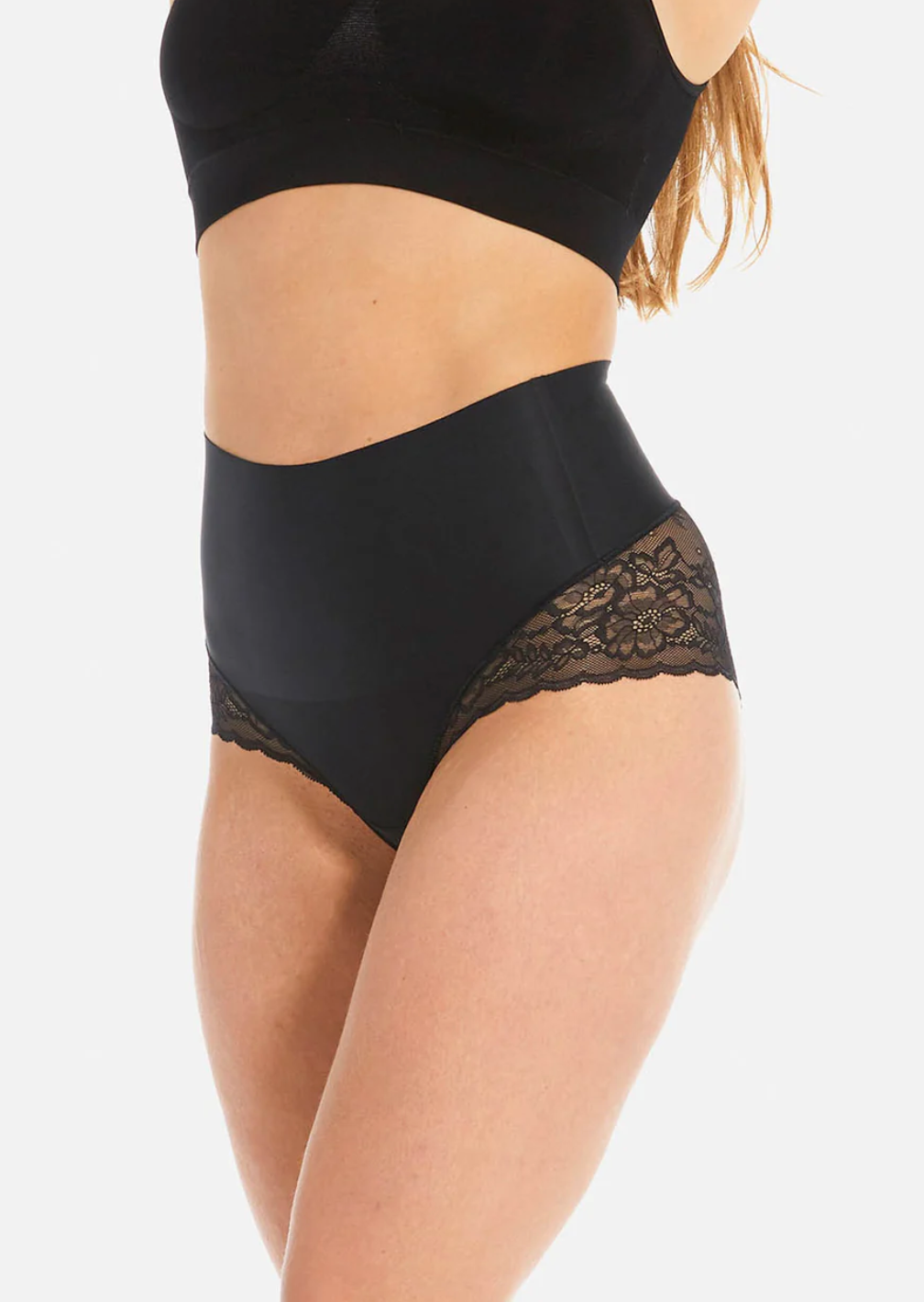 Black high-waisted underwear with lace trim on a white background