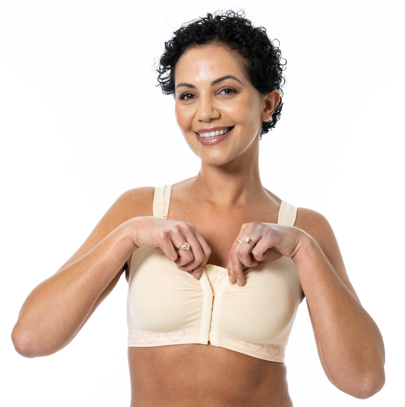 Woman wearing a beige bra on a white background