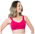 Woman wearing a pink bra with heart patterns on a white background Post surgery cancer bra