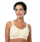 Woman wearing a beige bra on a white background