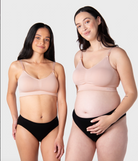 Two women wearing ballet pink nursing maternity bra and black underwear on a plain background