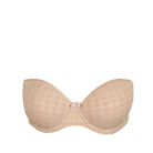 Beige bra with a decorative clasp on a white background