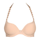 Beige bra with decorative straps on a white background
