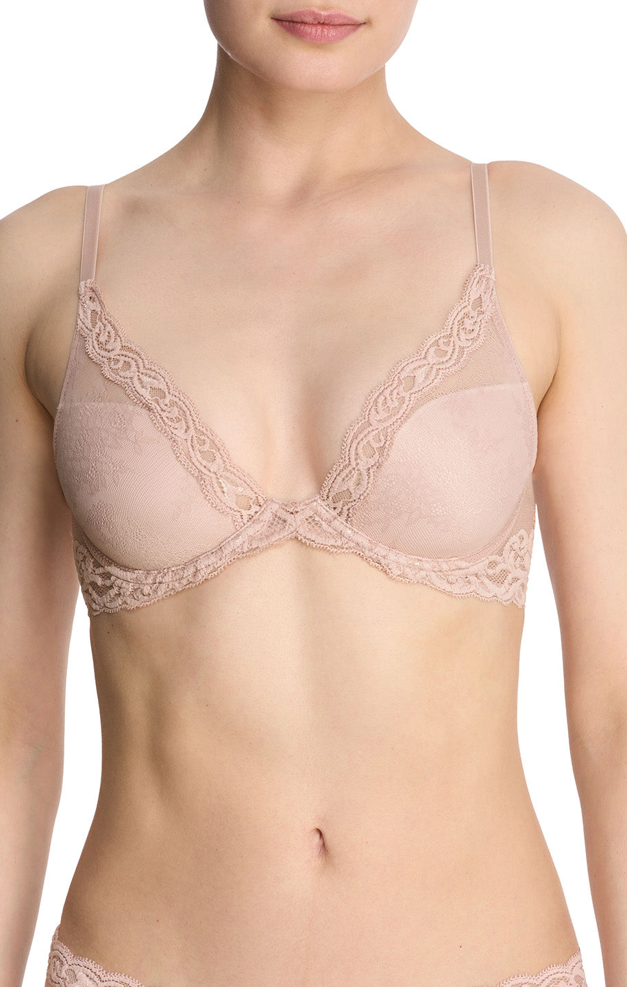 Beige bra with lace details on a model against a white background