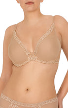 Beige lace bra and panties set on a white background