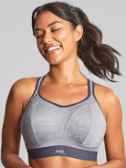 Woman wearing a gray sports bra with a visible brand logo on a plain background