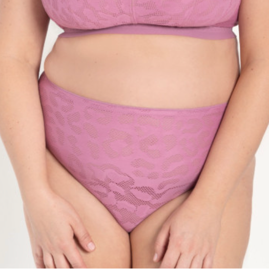 Woman wearing a purple lingerie set on a white background