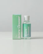 Softt Renew Cleanser bottle showcasing gentle formula for cleaning Softt adhesive products, perfect for maintaining stickiness and comfort.