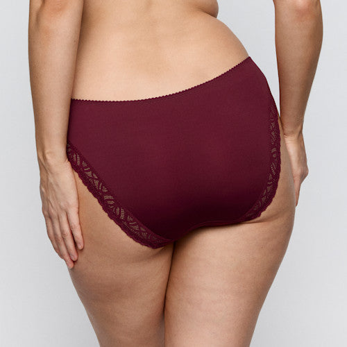 Maroon underwear with lace trim on a plain background
